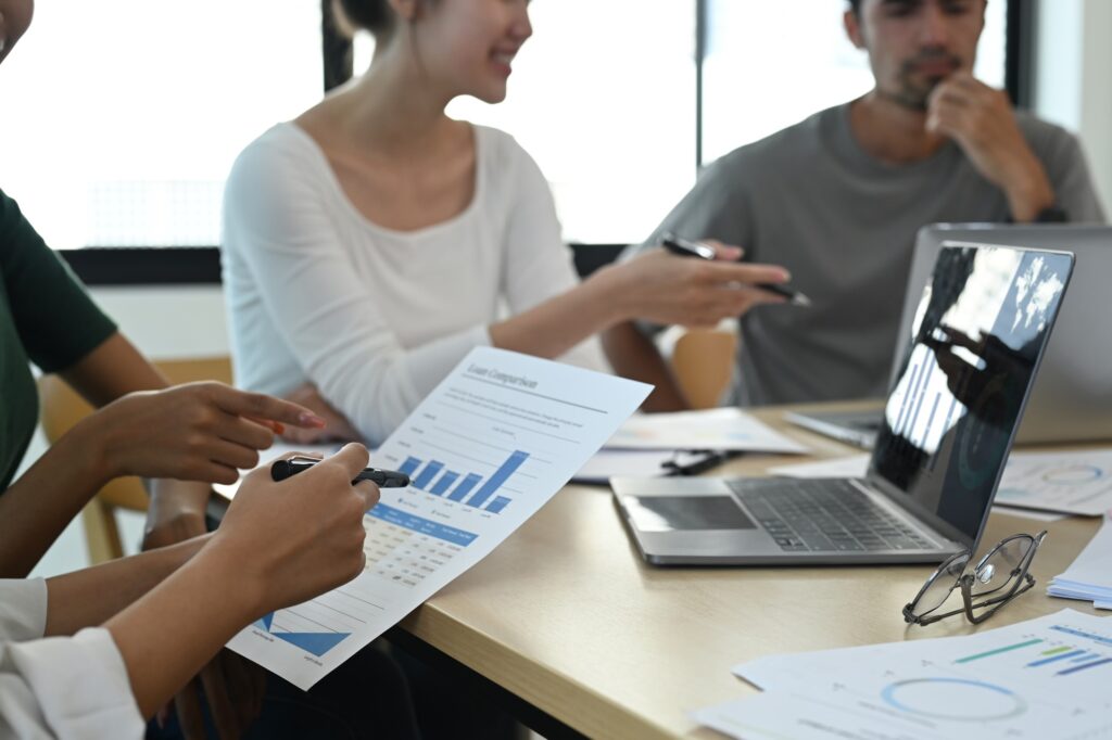 Team of start up business people brainstorming and preparing presentation.